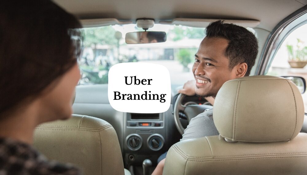 Uber branding; Driver smiling back at the passenger