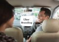 Uber branding; Driver smiling back at the passenger