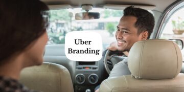 Uber branding; Driver smiling back at the passenger